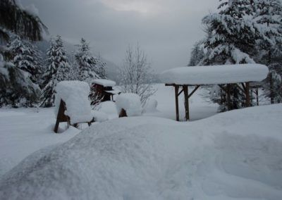 Snowy grounds near the cabin rental units.